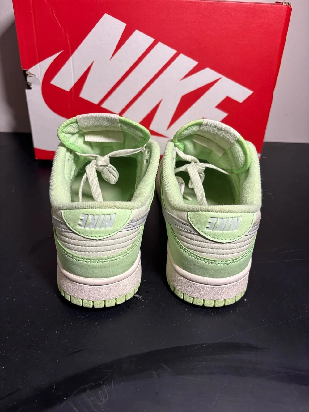 Nike Low-Top Sneakers in Light Green and Cream with Silver Swoosh